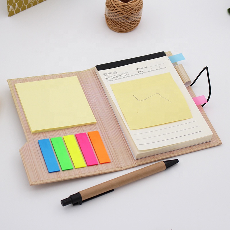 Dated notepad with sticky notes, tabs and pen